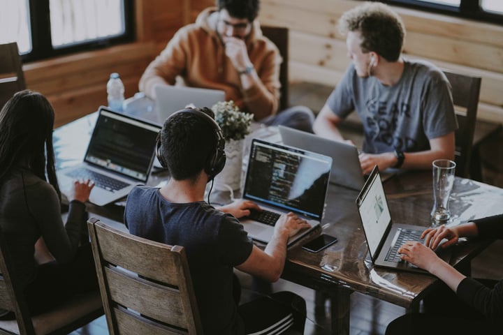 RevOps Team Meeting with laptops & people